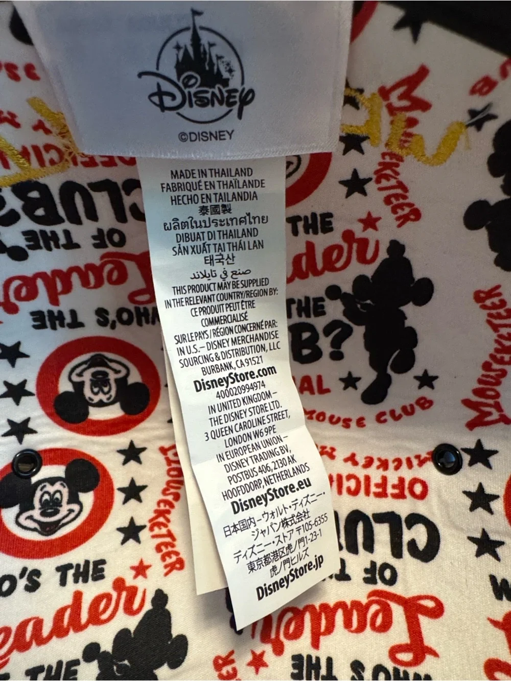 Disney black Mickey Mouse ears hat with red patch.